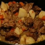 Potatoes stewed with meat and mushrooms