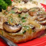meat with mushrooms and cheese in the oven