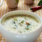 Soup with oyster mushrooms and melted cheese